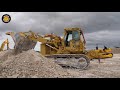 Cat D4D Dozer Helping The  983B Loader