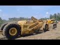 Cat D8 2U with D17000 V8 engine pulling a cat 70 (?) scraper.