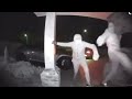 2 Men kicking a door at night