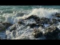 Остров из камня накрывается волнами с брызгами и морской пеной #sea #seawaves #nature