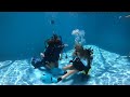 The Dive Girls practicing dive skills in the pool