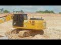 Work site video of dump truck and Excavator cat 320gx