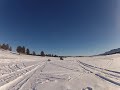 Quad pulling sled in snow