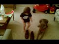 Cael putting daddys shoes on