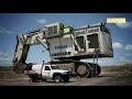 The World’s Biggest Excavator in Action (LIEBHERR R 9800 Excavator Loading Trucks)