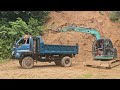 excavators and trucks Transporting landslides of land into people's homes.