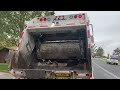 Burrtec Autocar WX McNeilus Rear Loader picking up bulky waste