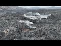 Lava field cooling down, Iceland volcano near Sýlingarfell - 2024, June the 20th - by drone 4K 60fps
