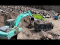 Sand mining|| Excavators dig sand to bury large rocks that hinder sand mining||excavtor working