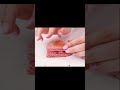 a girl makes a pink burger