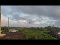 plane landing over lighthouse in Kauai