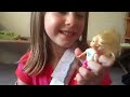 Brooke playing with her dolls