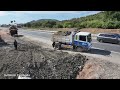 New project: 5 ton truck stopped on ASEAN road to fill the road with bulldozer pushing soil fast