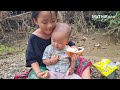 The orphan girl collects trash and bottles to sell to earn money to support her 2- year-old brother