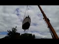 Colvic Northerner being lifted over trees from canal.