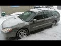 Scraping ice off the car