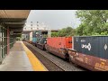 CSX 3447 leads a long eastbound stacker past the Syracuse train depot with horn salutes