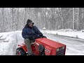 10 horsepower garden tractor pushing 54” snow plow!!!