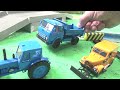 Tractors and trucks build a railway