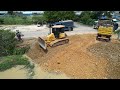 Perfect opening New project showing Mighty Bulldozer Komatsu working push Stone Fill into the water