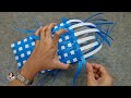 How to weave a bag from blue-white plastic threads