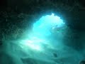 Diving through caves at Makaha beach west side Oahu