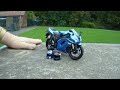 Photographing a model motorcycle.