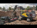 Cleaning accessories with the Volvo EW 180 E and digging other foundations