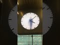 Man in a clock. Amsterdam, Schiphol Airport.