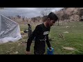 A terrible storm and flood hit a family alone in the mountains and caused water to enter their tent.