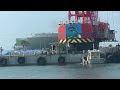 ８月６日　クレーン船ミキサー車パイプ車を渡船（Crane ship, mixer truck, pipe truck delivered to breakwater）