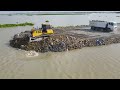 The Huge leak Skill Operating Big Bulldozer Moved Stone And Dumper Truck Puoring Rock Nice Action