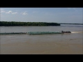 Mississippi River Flood 2011  Barges battling the current at Vicksburg