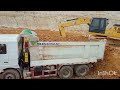 Work on site of dump truck and Excavator cat 320gx