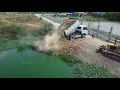 Fill the flooded area with soil, Bulldozer D31P KOMATSU, 5Ton dump truck unloading, Mix 2VDO