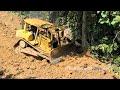 The Skilled  Operator CAT D6R XL Dozer Leveling Mountain Road