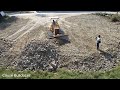 Develop land!! KOMATSU D31P Dozer pushing stone soil delete grass process with medium dump trucks
