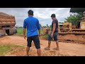 Dozer Pushing Dump Truck from Mud