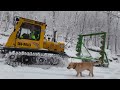 Grooming snowmobile trails