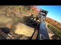 ￼ Operating the 236B cat skid steer with the Land Honor￼ motor grader attachment. ￼