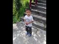 small boy walking in road