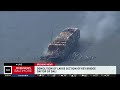 Explosions demolish large piece of Key Bridge from top of container ship