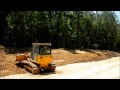 Dozer Cutting Down Slope