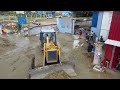 The Huge Machines Bulldozer And Dumping Truck In Project Warehouse Construction By Fill Sand