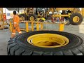 this is how to change the big tire for  Caterpillar 777E haul truck. skilled tire man. #caterpillar