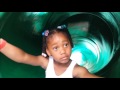 Sassy little girl blocks the slide at the zoo