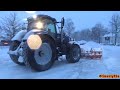 4K| New Holland T7.250 Plowing Snow In A Parking Lot