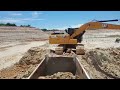 Stand recording work activities of excavator CAT320gx