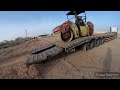 Heavy Equipment Unloading from Trailer Lowbed