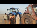 New Holland Tractor pulls another tractor stuck in mudجرار يسحب جرار آخر عالق في الوحل